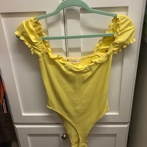 Cute yellow bodysuit, barely worn, great condition
